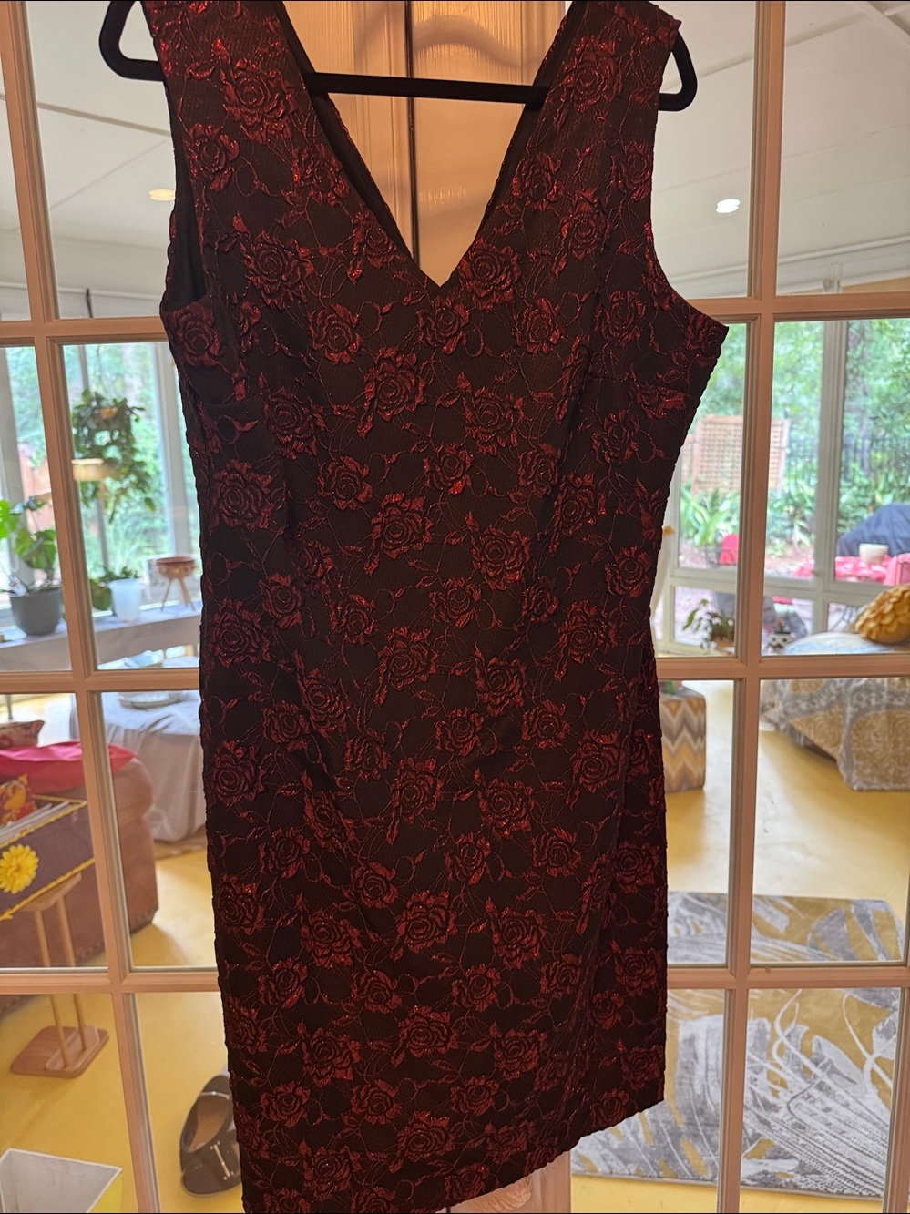 Beautiful  red Rose embossed on black cocktail dress. V neck in front and back.